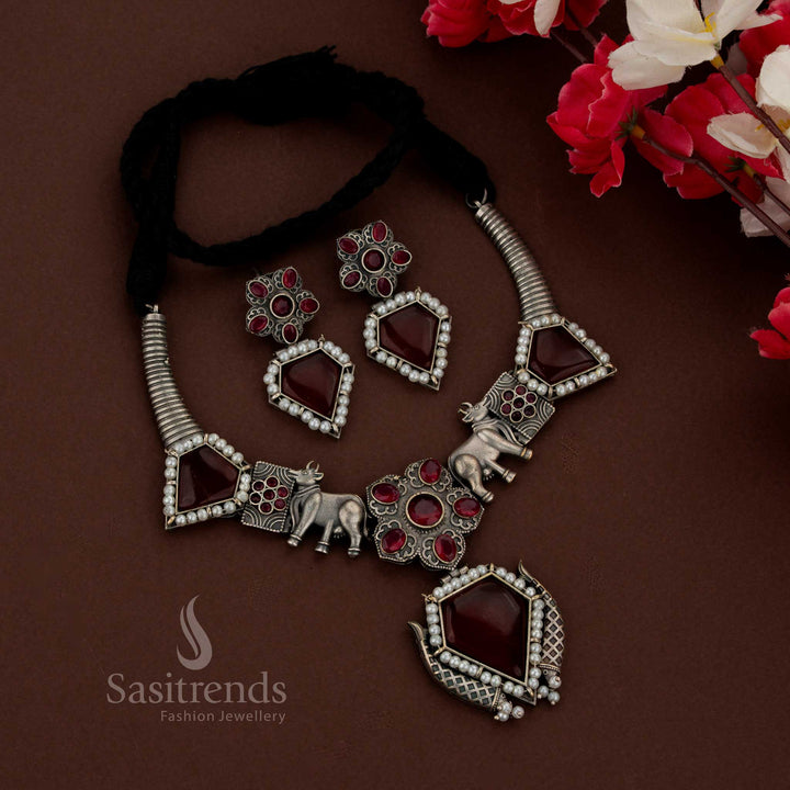 Sasitrends antique red oxidised jewellery set crafted with Gomatha design in rigid husli form paired with geometric pendant and studs