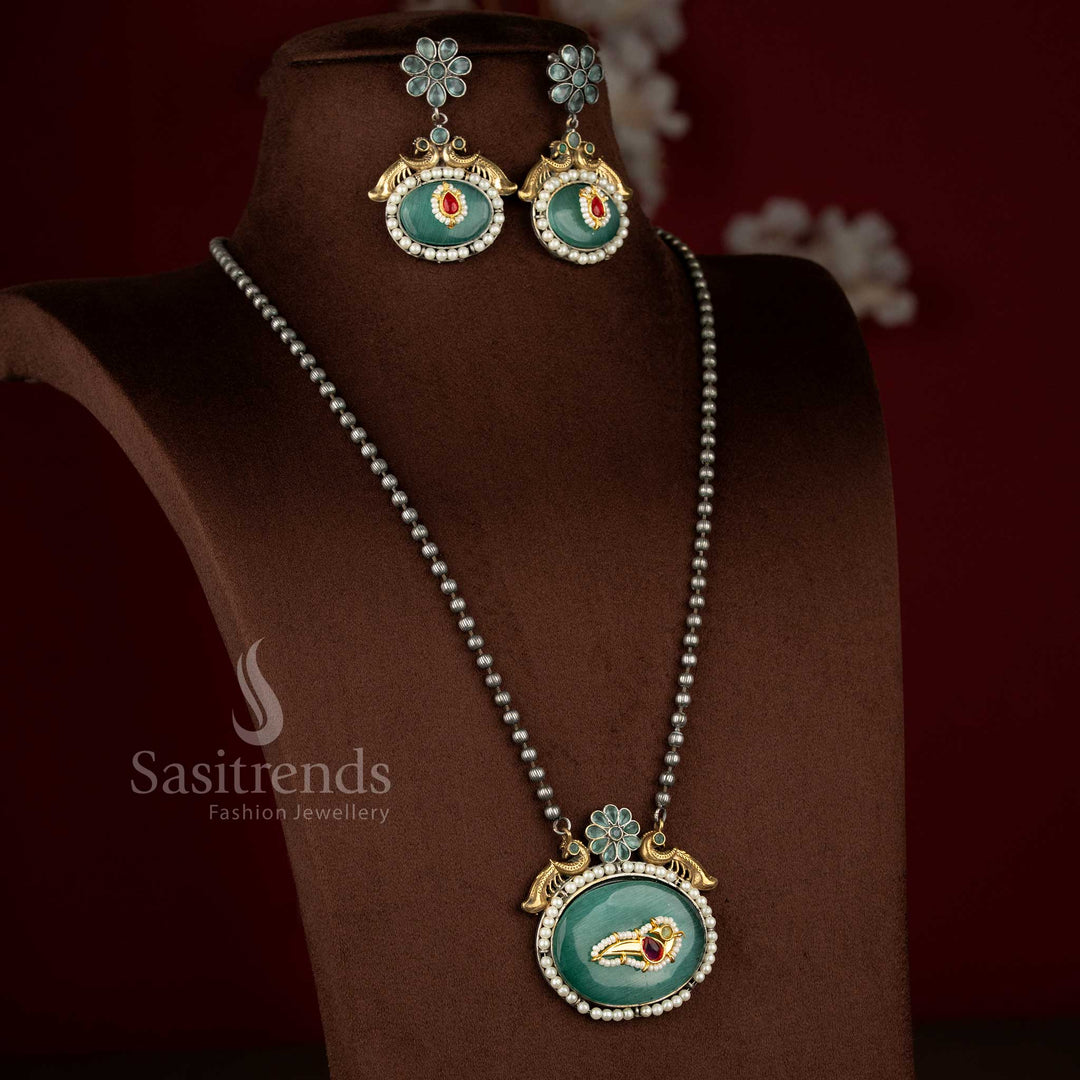 Sasitrends antique oxidised 92.5 Silver Plated peacock floral oval pendant long mint stone necklace set with heritage inspired structure.
