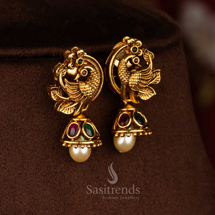 Sasitrends rich look matte gold plated ruby green Ad stone peacock pendant necklace set suitable for weddings and festivals