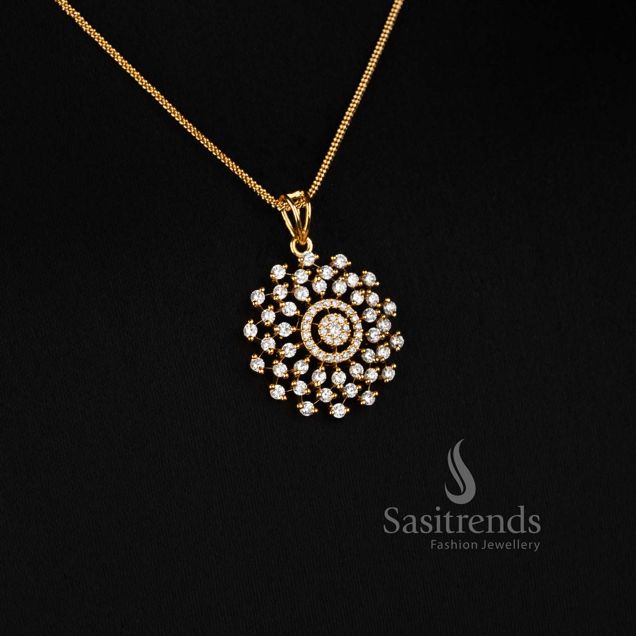 Elegant Sasitrends Micro Gold Plated American Diamond pendant necklace featuring concentric circular stone detailing and coordinated clustered stud earrings for party wear