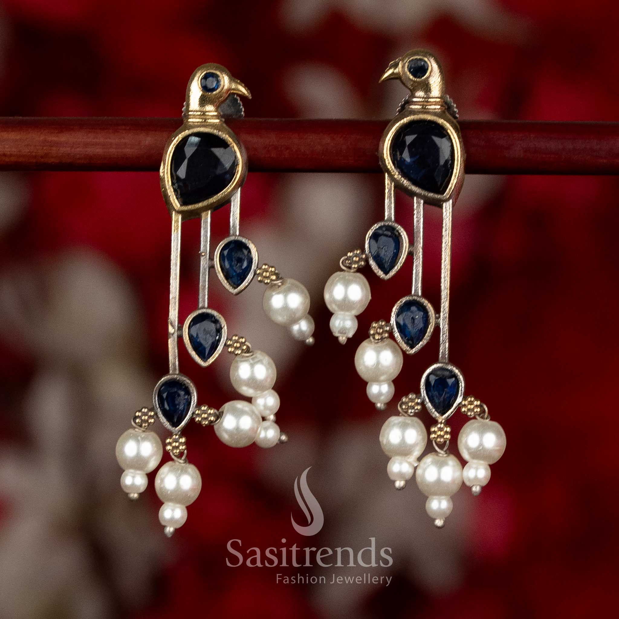 Sasitrends parrot inspired oxidised silver long earrings in blue colour with detailed stone framework and pearl embellishments for saree wear
