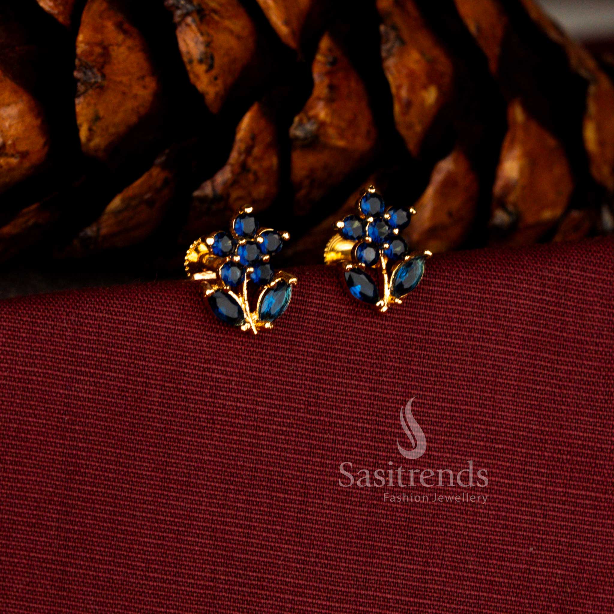 Sasitrends bridal one gram micro gold plated blue AD stone earrings designed in a stunning starburst floral pattern with detailed marquise leaf motifs and rich gold tone lustre.