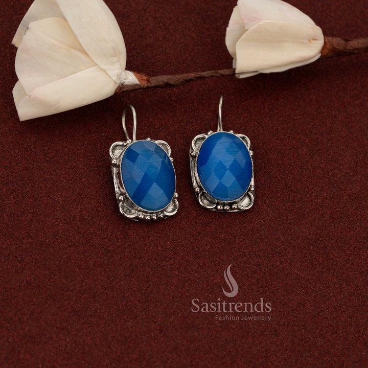 Sasitrends classic royal blue oxidised German silver drop earrings designed with oval stone and traditional floral frame finish