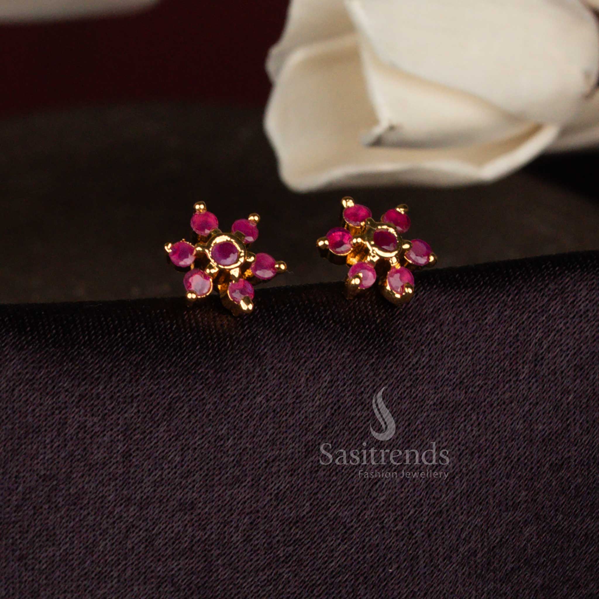 Sasitrends elegant ruby AD stone micro gold plated stud earrings showcasing a structured star floral design for office and festive styling