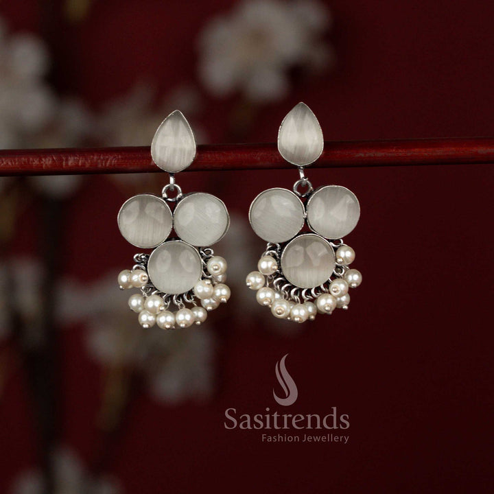 Contemporary white oxidised silver teardrop and round Monalisa stone earrings by Sasitrends finished with elegant pearl hangings, beautifully complementing kurtis, cotton sarees and relaxed professional settings.