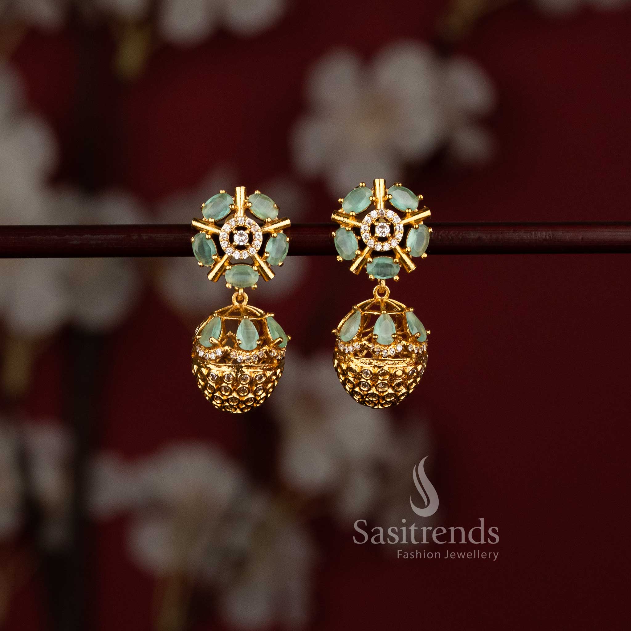 Sasitrends festive wear mint American Diamond matte gold plated earrings with circular floral top and layered dome jhumka structure