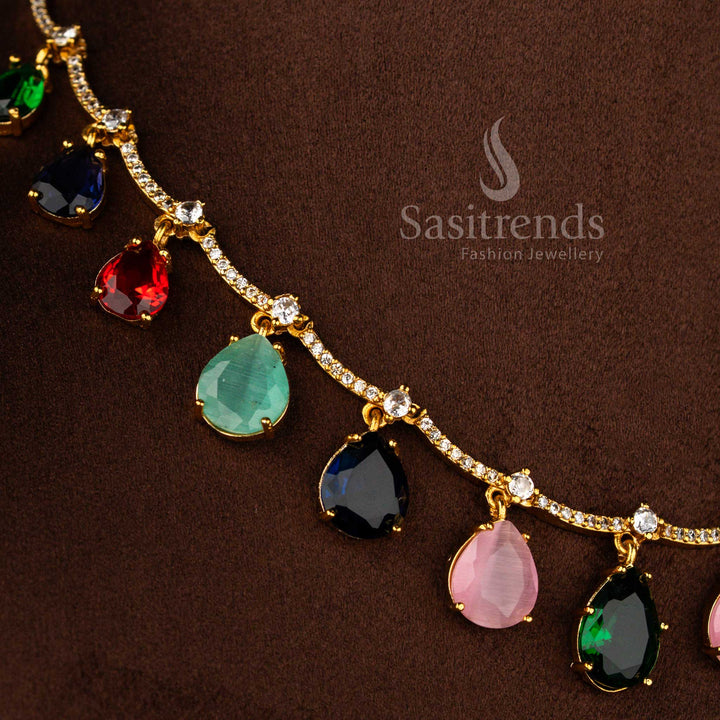 Sasitrends elegant matte gold plated Navarathna American Diamond necklace set with symmetrical drop elements and coordinated floral top earrings