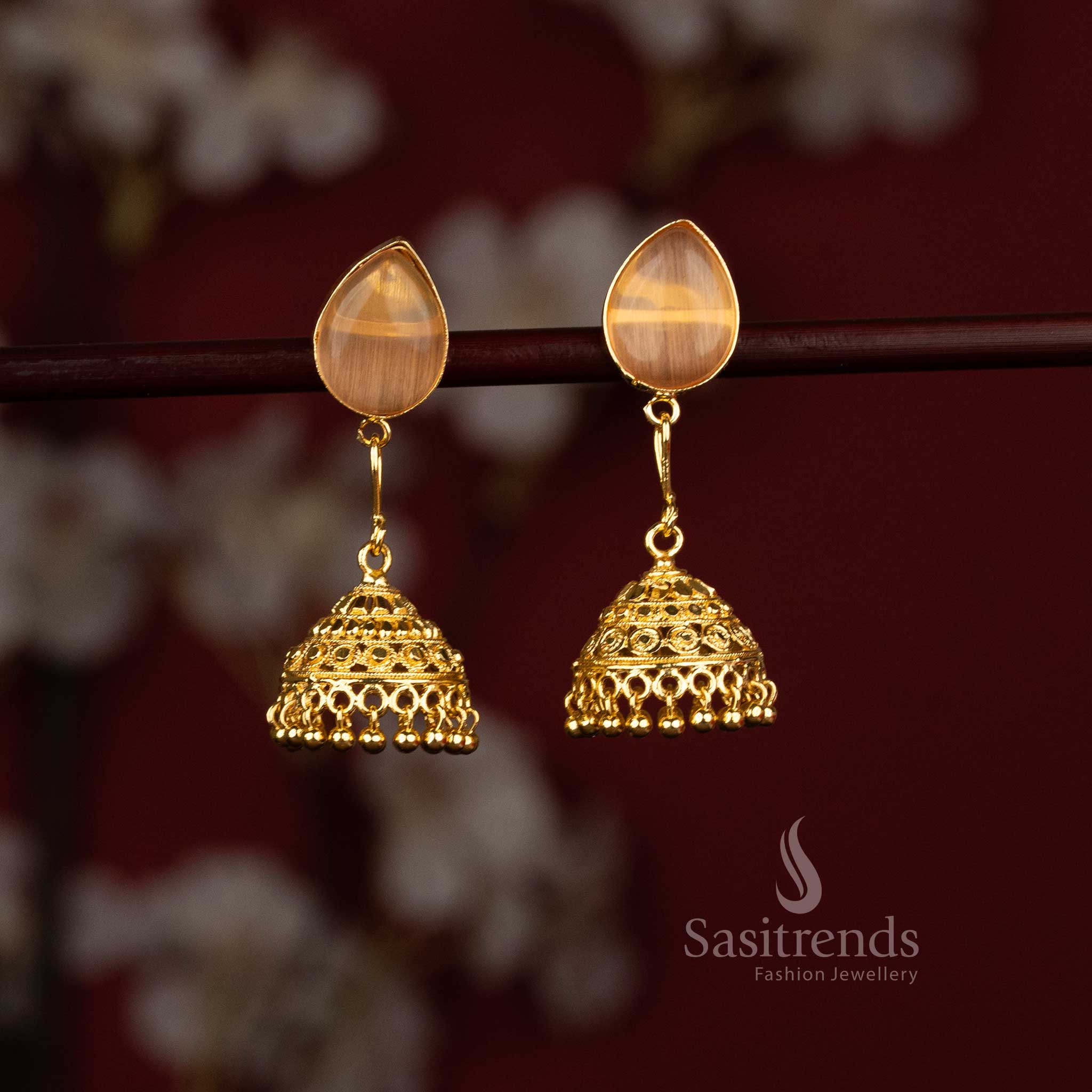 Sasitrends elegant gold plated orange pear motif jhumka earrings featuring classic bell shaped structure with pear inspired motif suitable for stylish ethnic and fashionable outfits