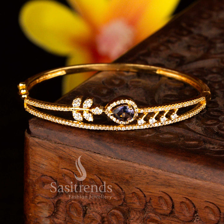 Sasitrends elegant micro gold plated floral teardrop white purple American diamond openable kada bracelet crafted with refined gold lustre and sparkling stones for festive occasions.