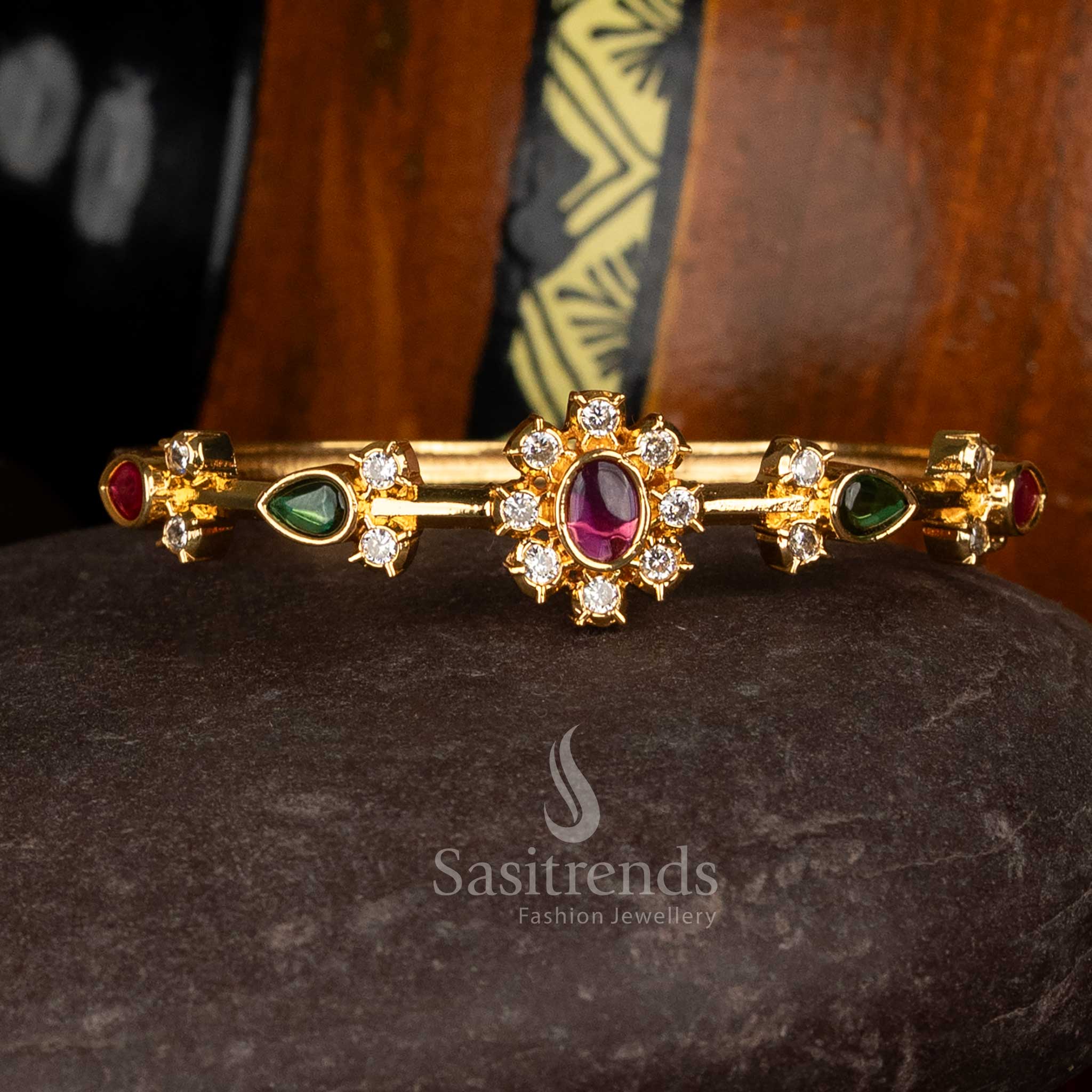 Sasitrends elegant party wear american diamond micro gold plated multi bracelet featuring oval centre stone and teardrop stone accents