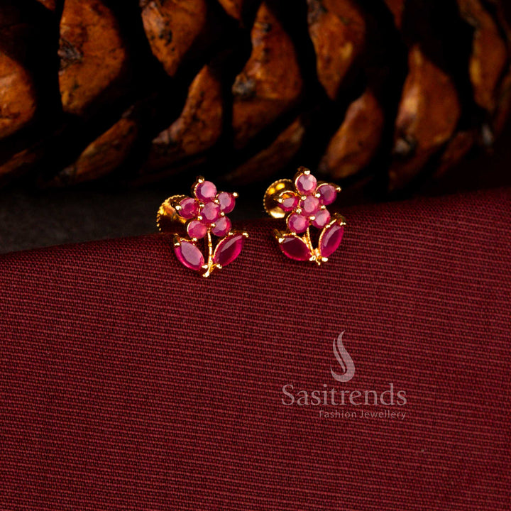 Sasitrends elegant one gram micro gold plated ruby AD stone earrings featuring a floral starburst design with marquise leaf craftsmanship and premium polish suitable for festive and party styling.