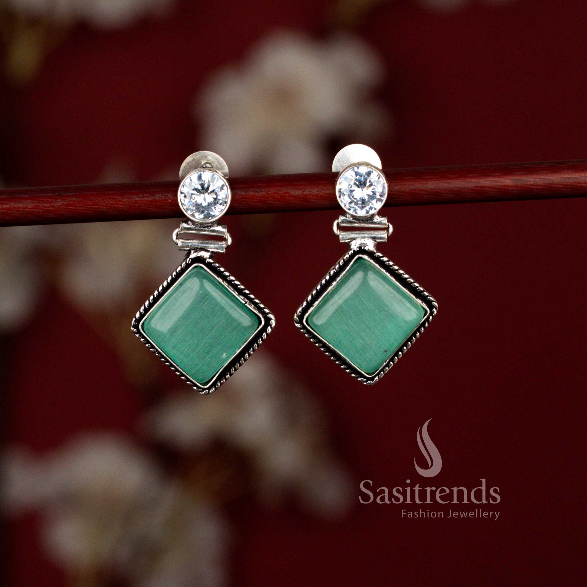 Elegant mint oxidised rhombus drop earrings from Sasitrends featuring an eye-inspired Monalisa stone centerpiece set in a textured silver tone frame, ideal for workdays, coffee meets and everyday traditional looks.