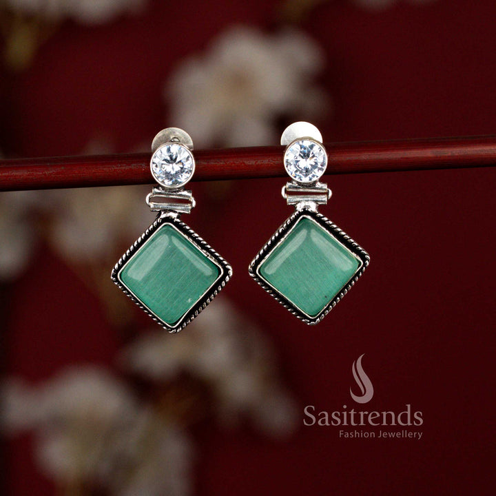 Elegant mint oxidised rhombus drop earrings from Sasitrends featuring an eye-inspired Monalisa stone centerpiece set in a textured silver tone frame, ideal for workdays, coffee meets and everyday traditional looks.