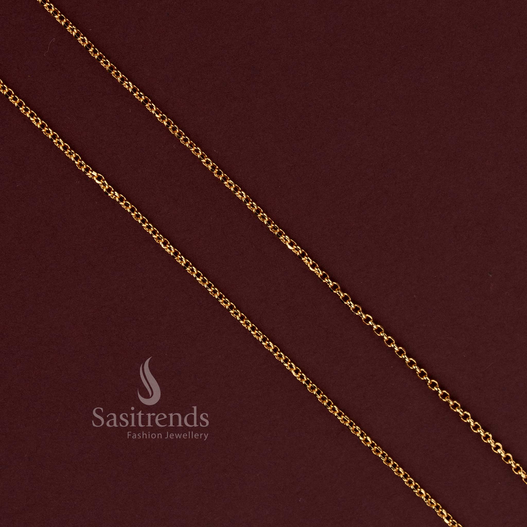 Sasitrends gold plated chain showcasing miniature elongated oval links connected in an alternating angled formation, creating an intricate repeating interlocking pattern