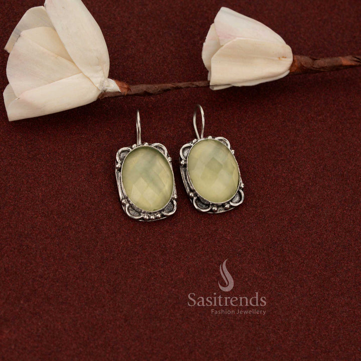 Sasitrends ethnic inspired oxidised German silver drop earrings featuring oval light yellow stone within an ornate floral frame