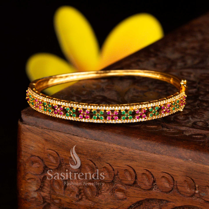 Sasitrends ethnic micro gold plated lattic two rows floral white multi American diamond openable kada bangle offering a royal gold appearance with sparkling stone highlights.