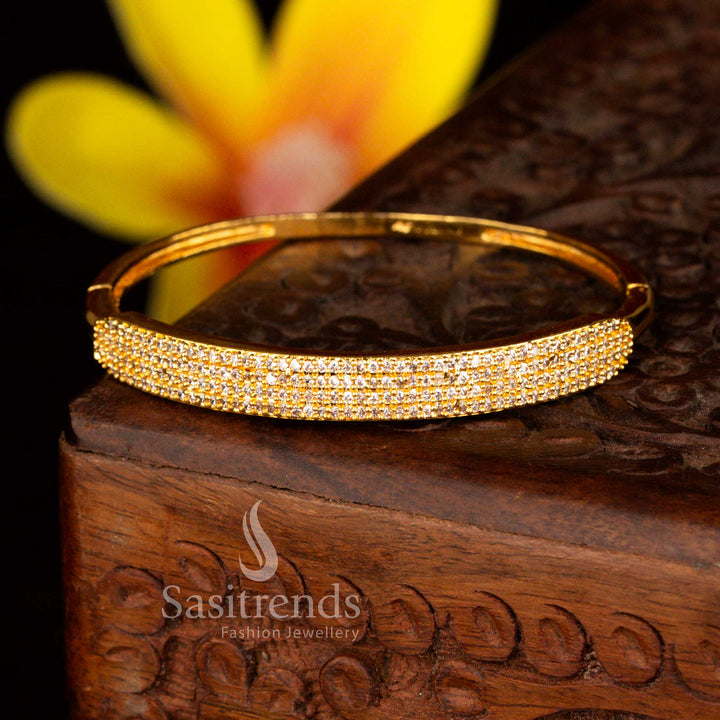 Sasitrends exclusive micro gold plated center bar pavé-set with multiple rows of round-cut crystals white American diamond openable kada bracelet crafted with precision stone setting and a radiant real gold look finish for festive elegance.