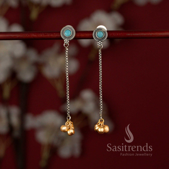 Sasitrends grand antique oxidised earrings featuring a radiant sunburst ocean blue stone design paired with a slender chain dangler and highlighted golden beads, offering a statement look for festive and traditional wear.