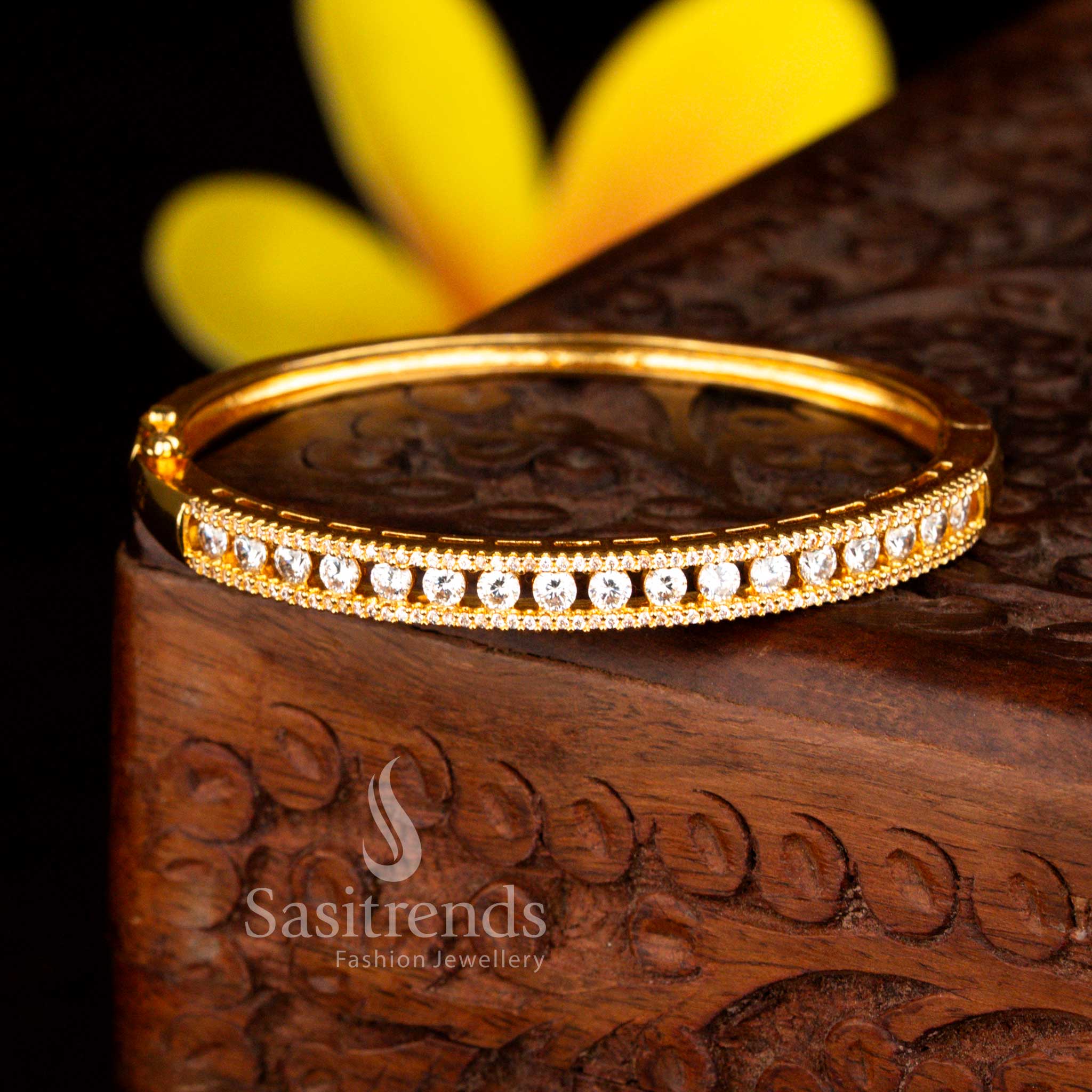 Sasitrends grand celebration micro gold plated two rows of petite white  American diamond openable kada bracelet designed with brilliant stone arrangement and premium polish.