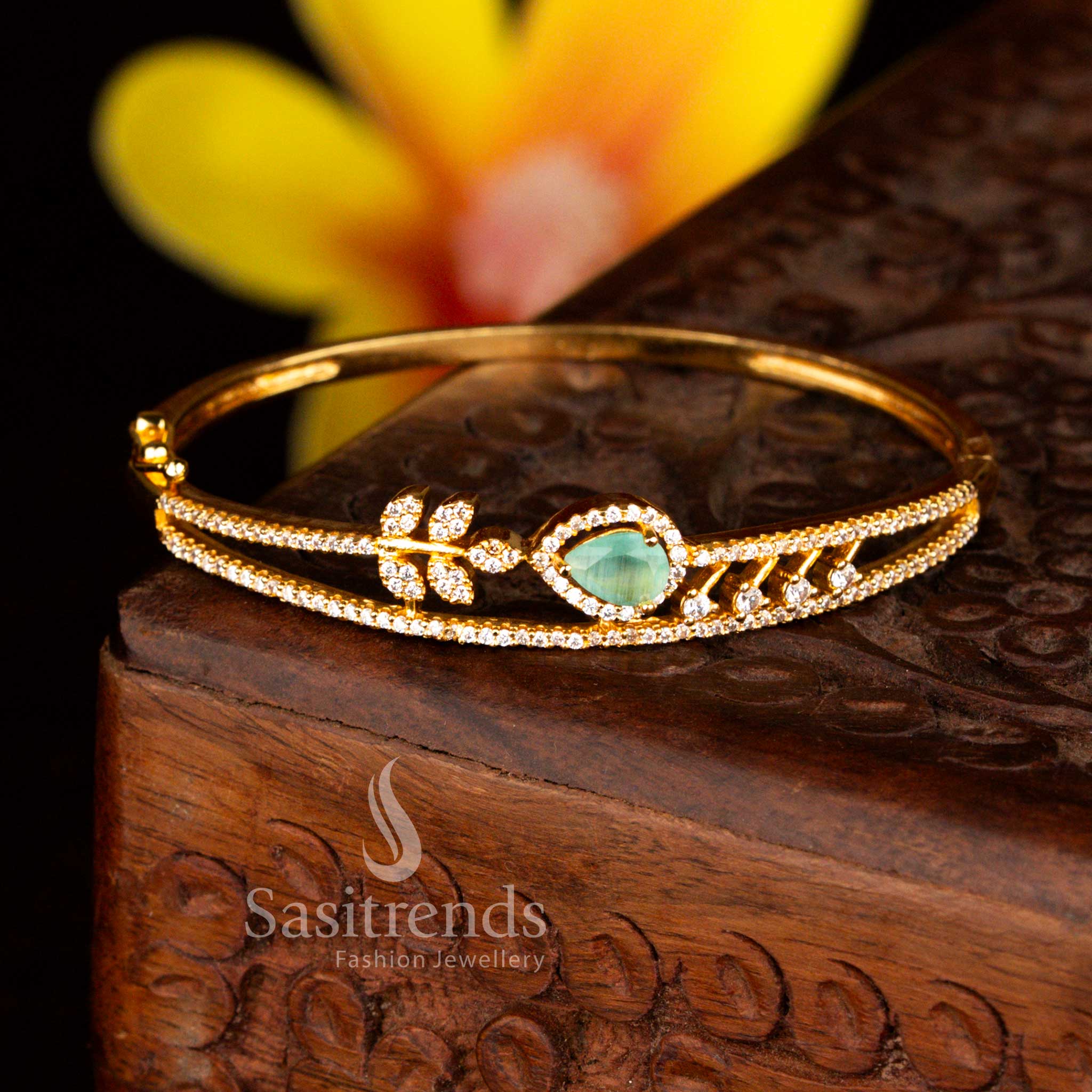 Sasitrends grand micro gold plated floral teardrop white mint American diamond openable kada bangle showcasing elegant stone detailing ideal for bridal and reception styling.