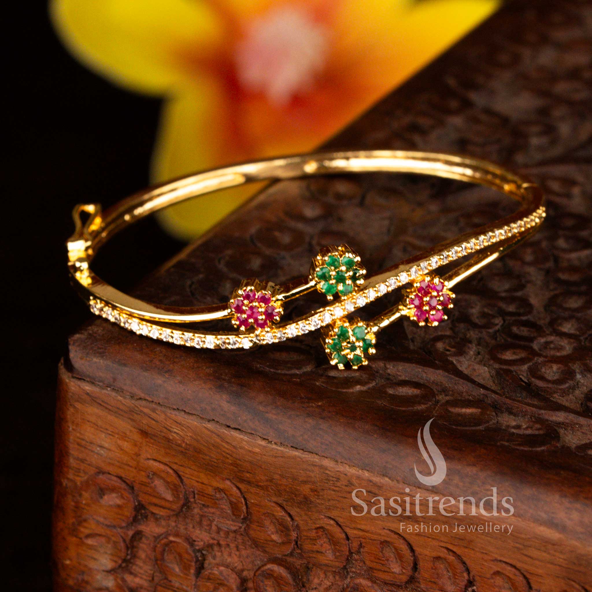 Sasitrends grand micro gold plated four floral-shaped crystal clusters multi American diamond openable kada bracelet showcasing brilliant stone embellishments and a guaranteed real gold appearance for festive celebrations.