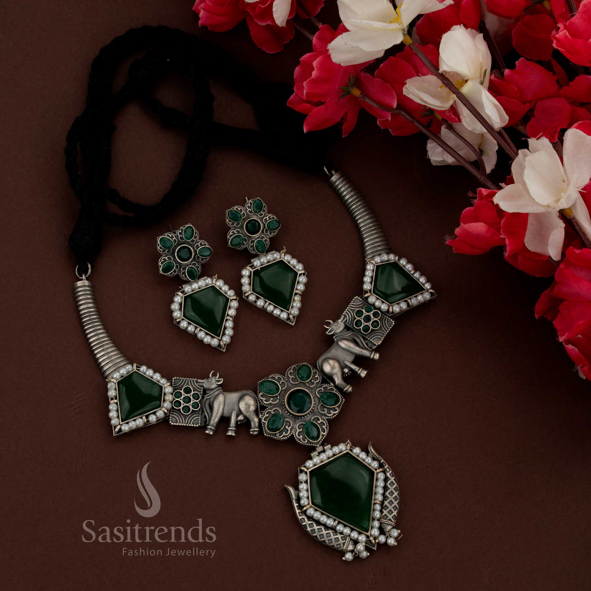 Sasitrends grand oxidised husli green necklace set crafted with Gomatha motif and geometric pendant suitable for festive and ethnic occasions