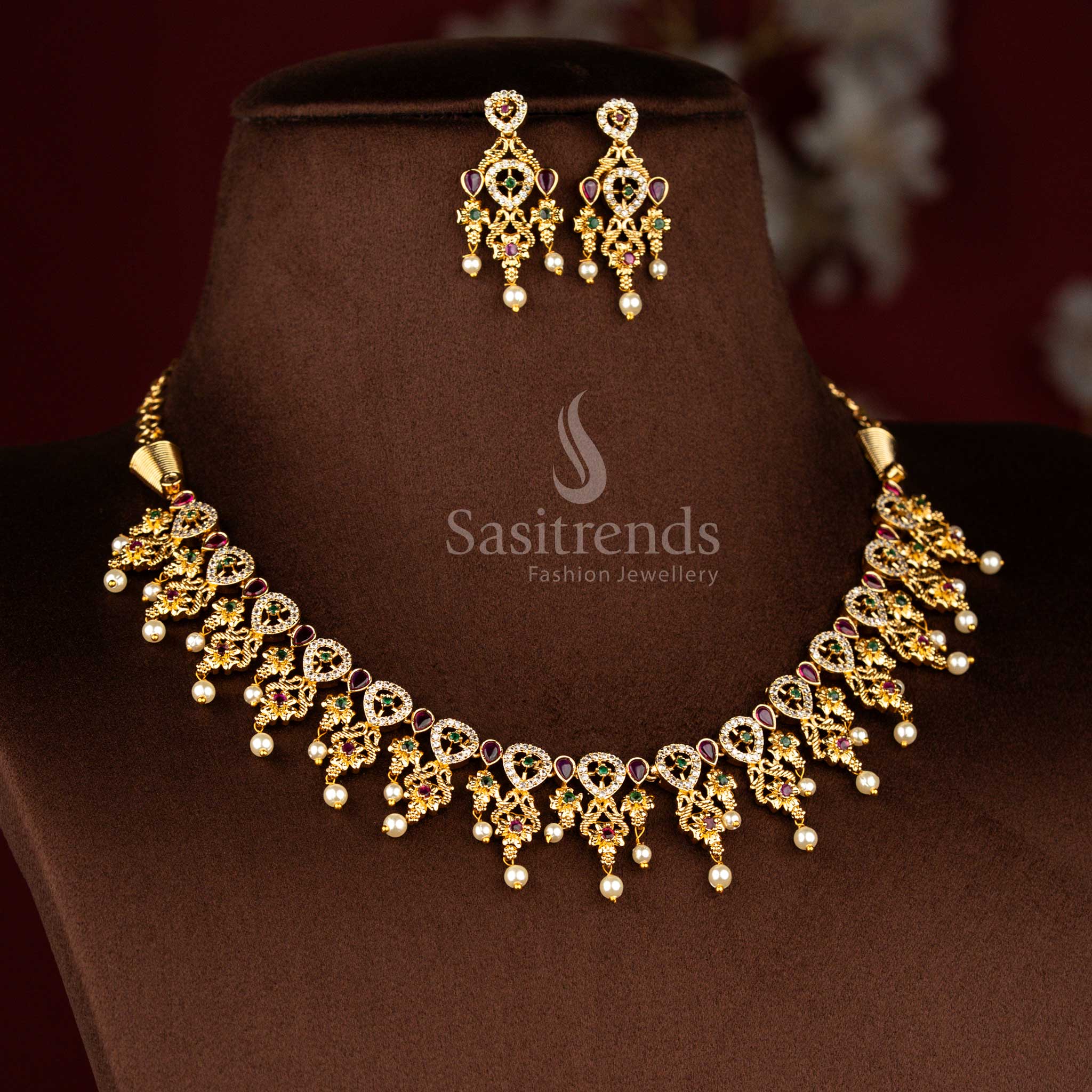 Sasitrends grand temple matte gold plated peacock teardrop floral motif pearl drop multi AD stone short necklace jewellery set featuring elegant temple detailing for engagement rituals, poojas, festive observances and heritage celebrations