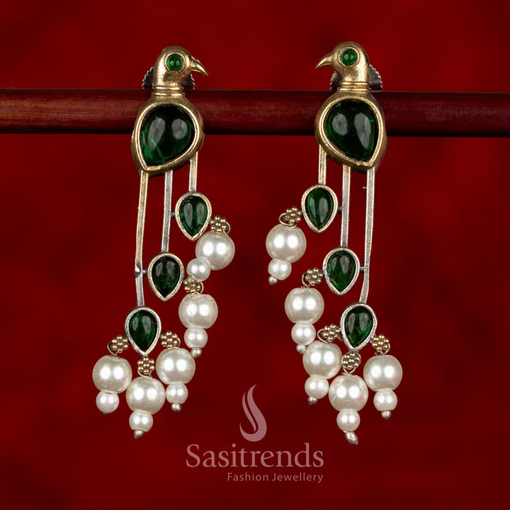 Sasitrends oxidised silver parrot motif earrings in rich green colour showcasing detailed stone arrangement and pearl drops for ethnic styling
