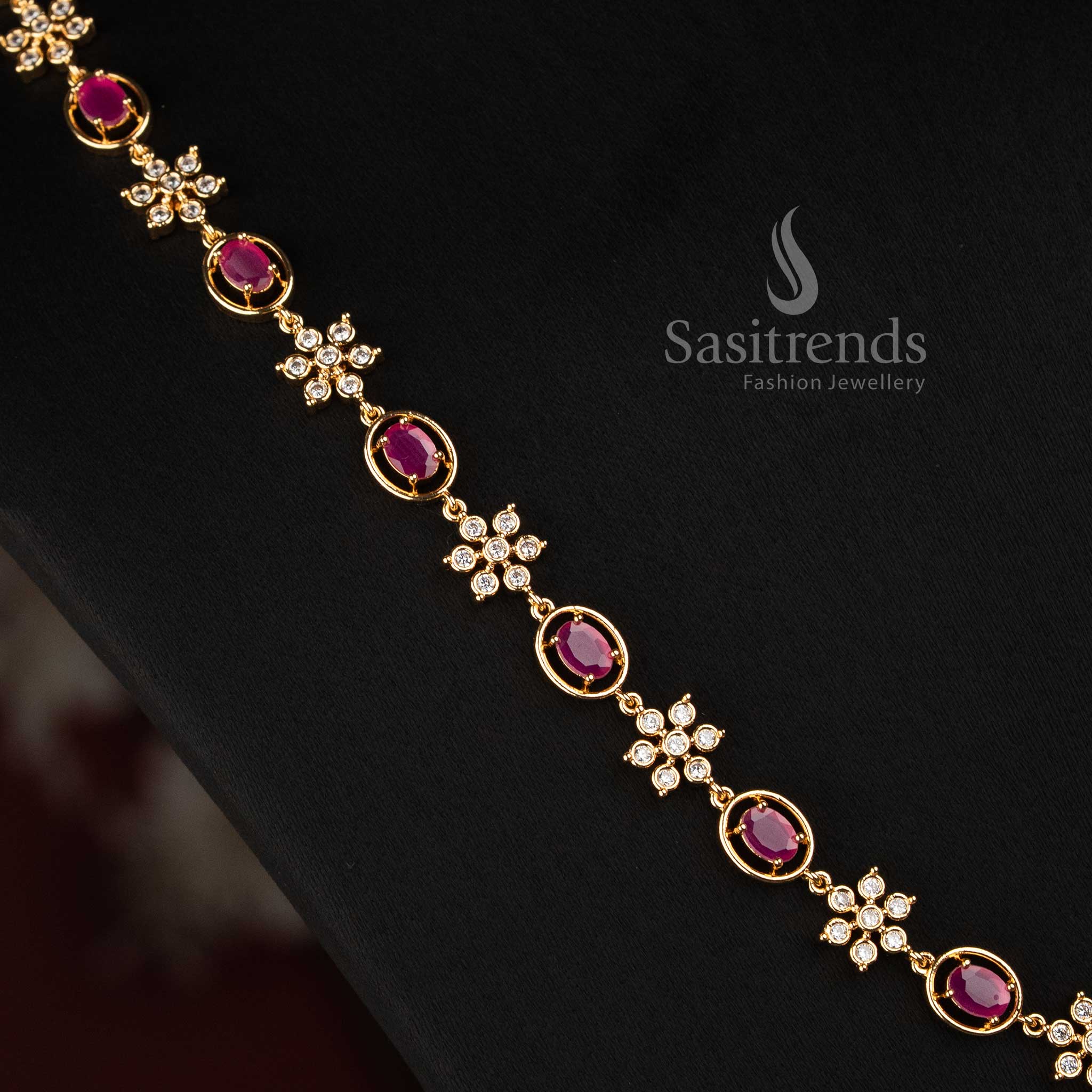 Sasitrends micro gold plated AD stone necklace set with floral arrangements, oval-shaped framed motifs and coordinated floral earrings 