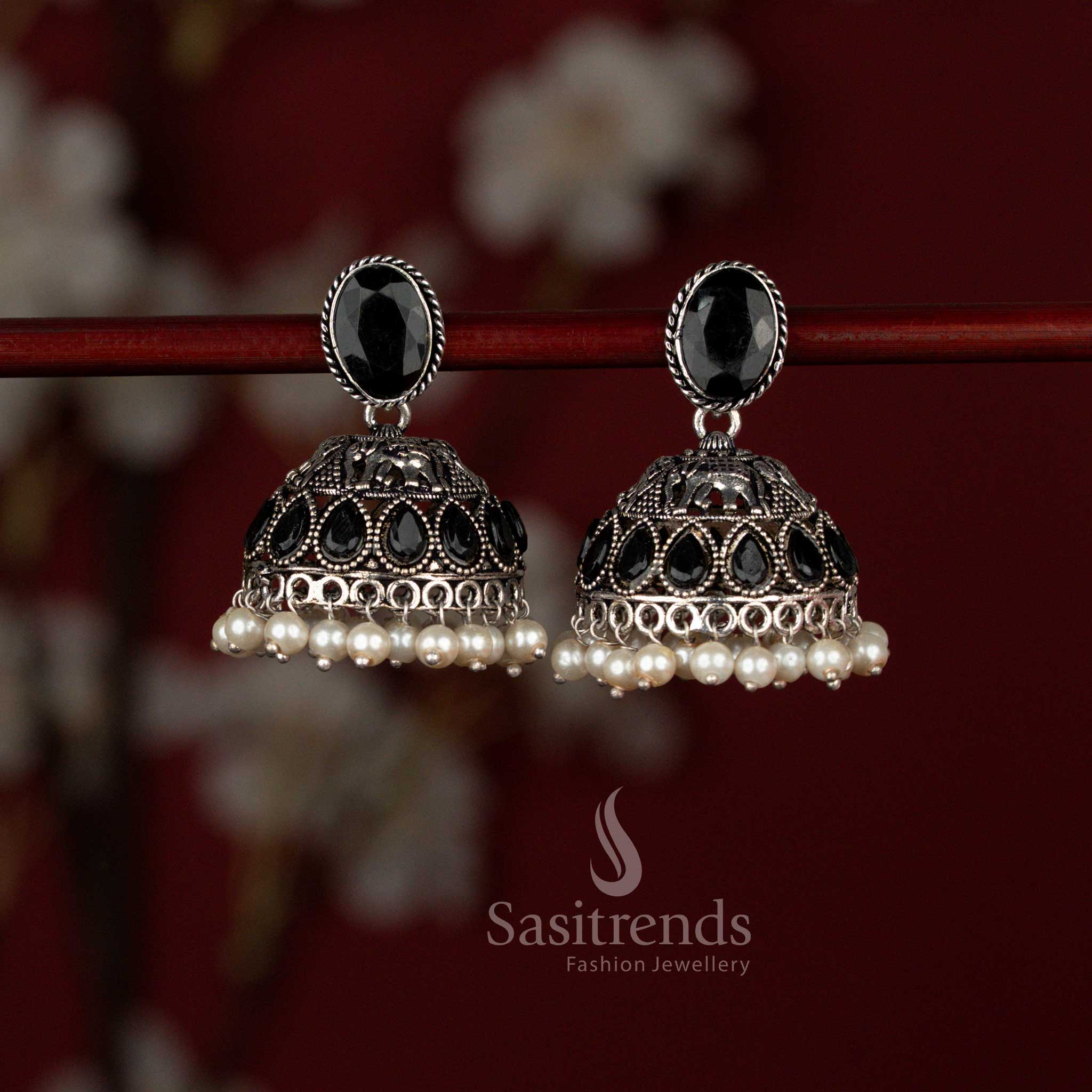 Sasitrends heritage inspired black oxidised German silver jhumka earrings crafted with an oval Monalisa stud, detailed elephant motif, shimmering teardrop stone embellishments and delicate pearl drops for festive and ethnic occasions.