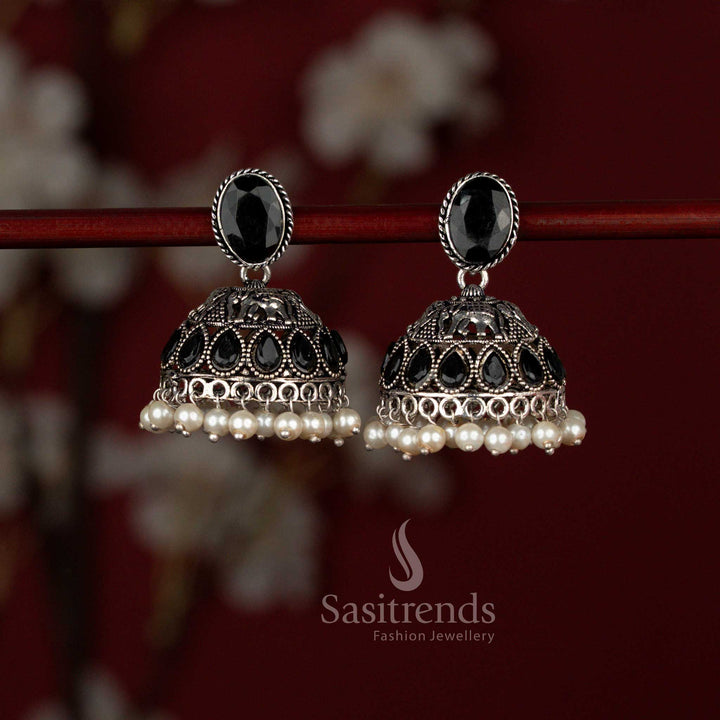 Sasitrends heritage inspired black oxidised German silver jhumka earrings crafted with an oval Monalisa stud, detailed elephant motif, shimmering teardrop stone embellishments and delicate pearl drops for festive and ethnic occasions.