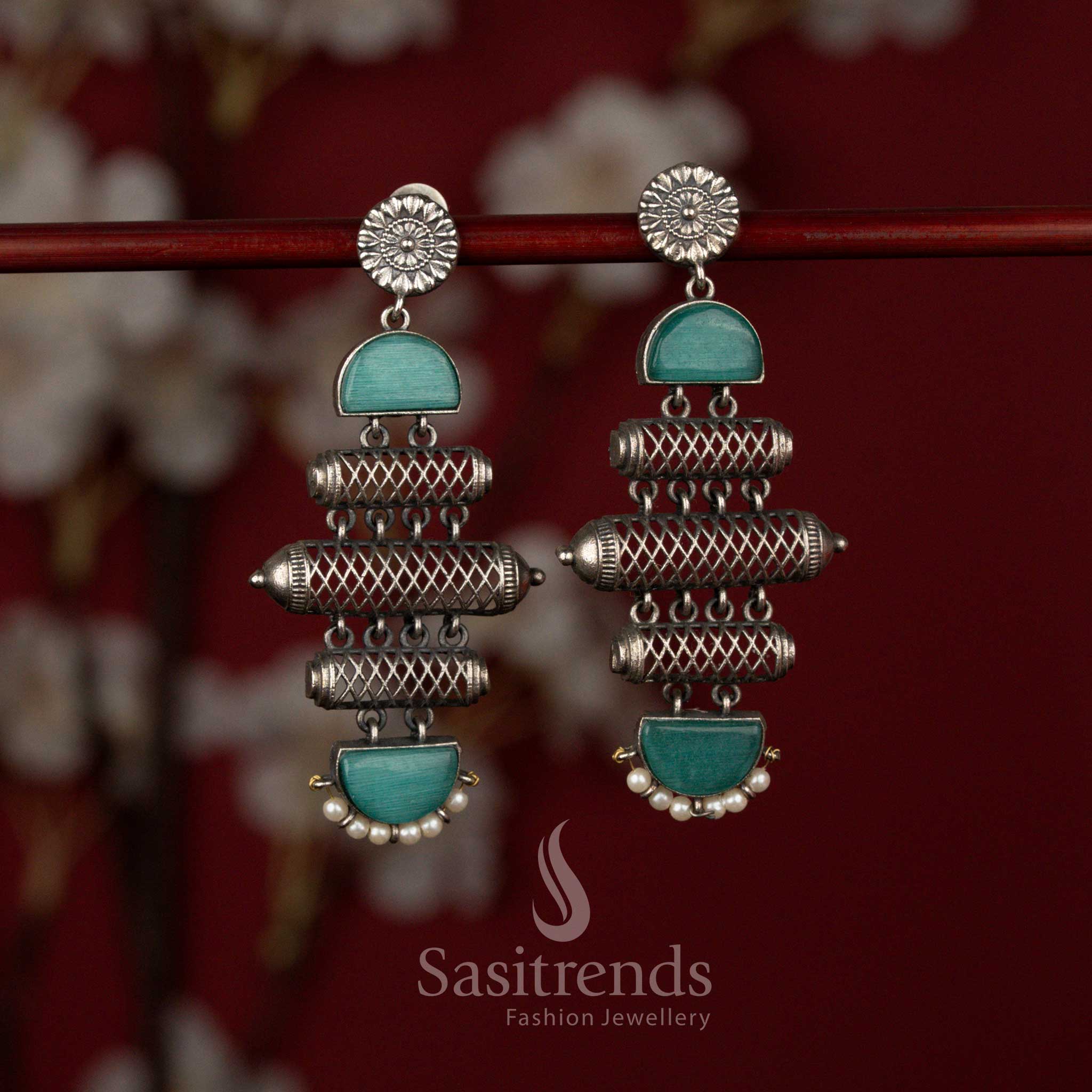 Sasitrends heritage inspired oxidised silver earrings featuring a structured barrel form with textured cylindrical artistry, accent stone panels and refined pearl drops perfect for sarees and festive ensembles.
