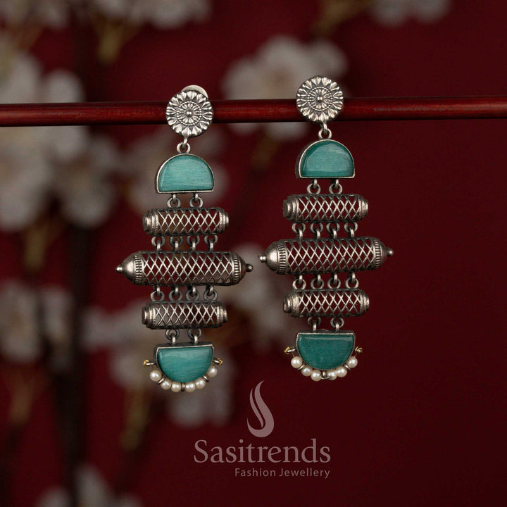 Sasitrends heritage inspired oxidised silver earrings featuring a structured barrel form with textured cylindrical artistry, accent stone panels and refined pearl drops perfect for sarees and festive ensembles.