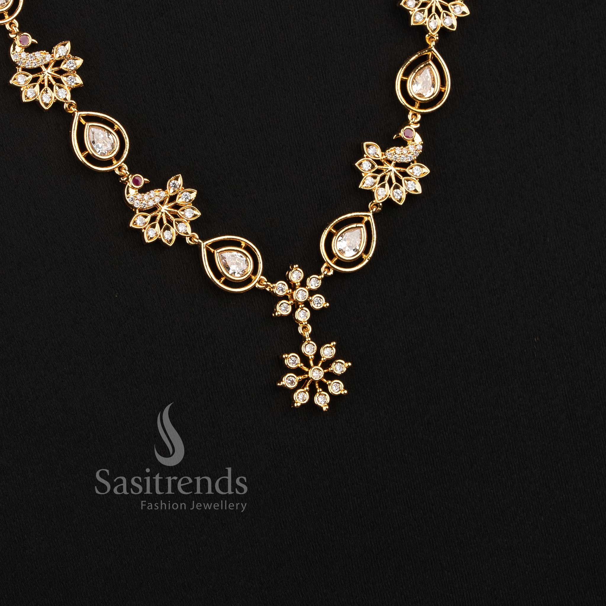 Sasitrends Impon Addigai necklace with floral AD stone motifs, distinctive pear-shaped settings and peacock-inspired ornamental centre detailing 