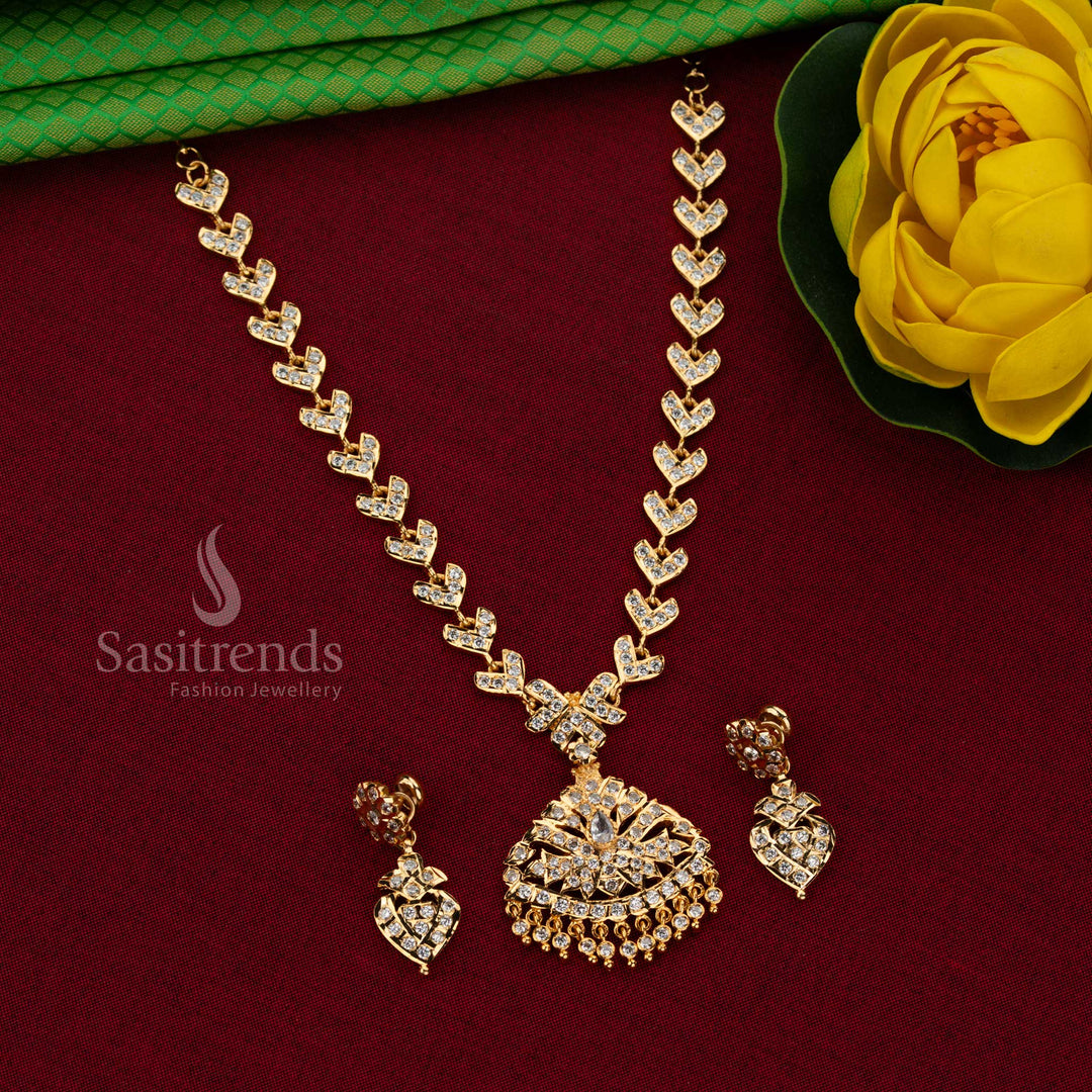 Sasitrends Impon Attigai One Gram Micro gold plated White AD Stone necklace set featuring leaf motif chain and broad fan-shaped pendant design