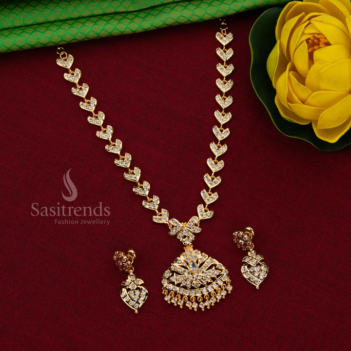 Sasitrends Impon Attigai One Gram Micro gold plated White AD Stone necklace set featuring leaf motif chain and broad fan-shaped pendant design