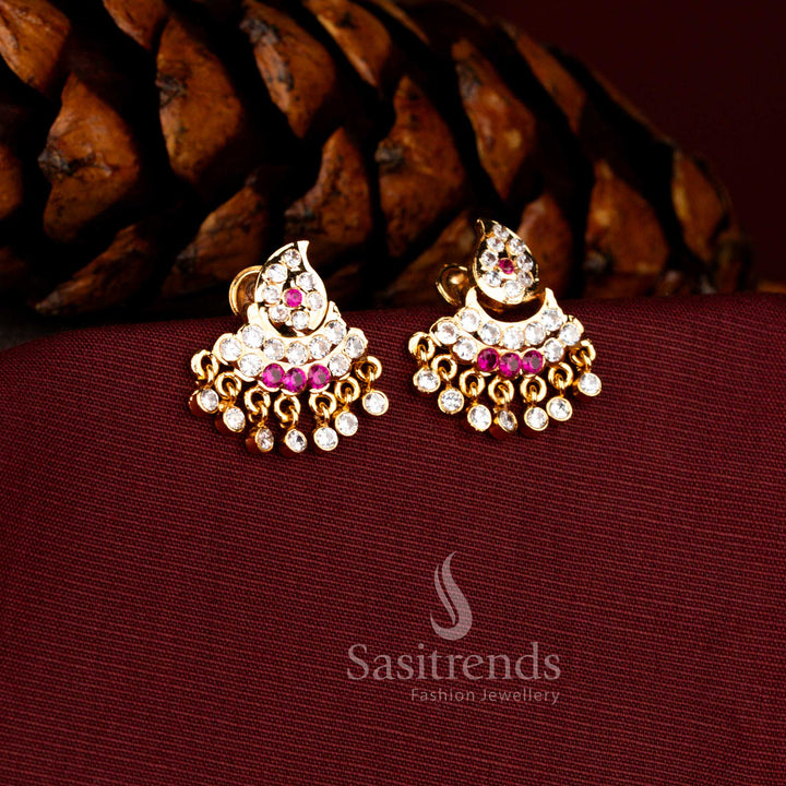 Sasitrends Impon micro gold plated white ruby AD stone paisley inspired temple hanging earrings with intricate curved detailing and elegant dangling stones, premium bridal and festive jewellery that looks like real gold finish.
