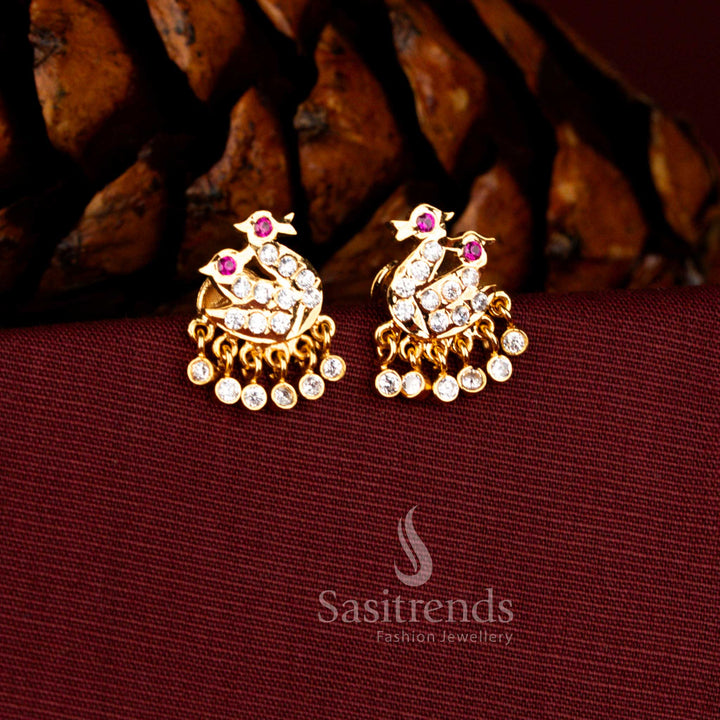 
Sasitrends Impon micro gold plated white ruby AD stone swan design temple hanging earrings with detailed stone setting and elegant drop danglers, premium bridal wedding jewellery look like real gold finish perfect for silk saree and festive traditional wear.
