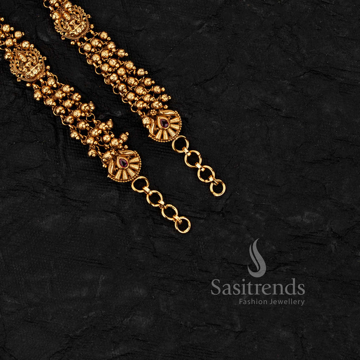 Temple matte gold plated ear chains featuring Lakshmi design with gold beads and pearl bead detailing in multi strand pattern - Sasitrends