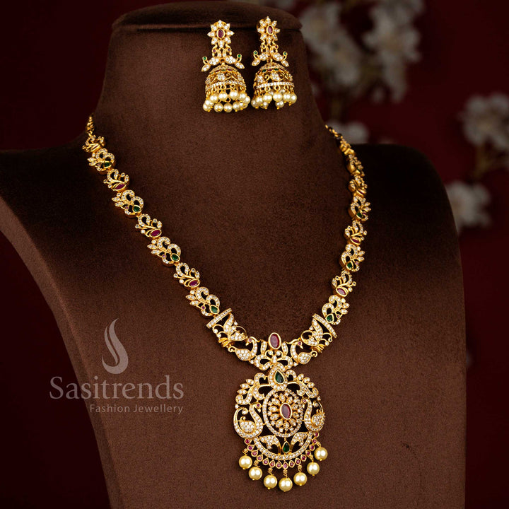 Sasitrends latest temple matte gold plated peacock and flower motifs bridal necklace jewellery set designed with rich traditional detailing for wedding and grand festive occasions