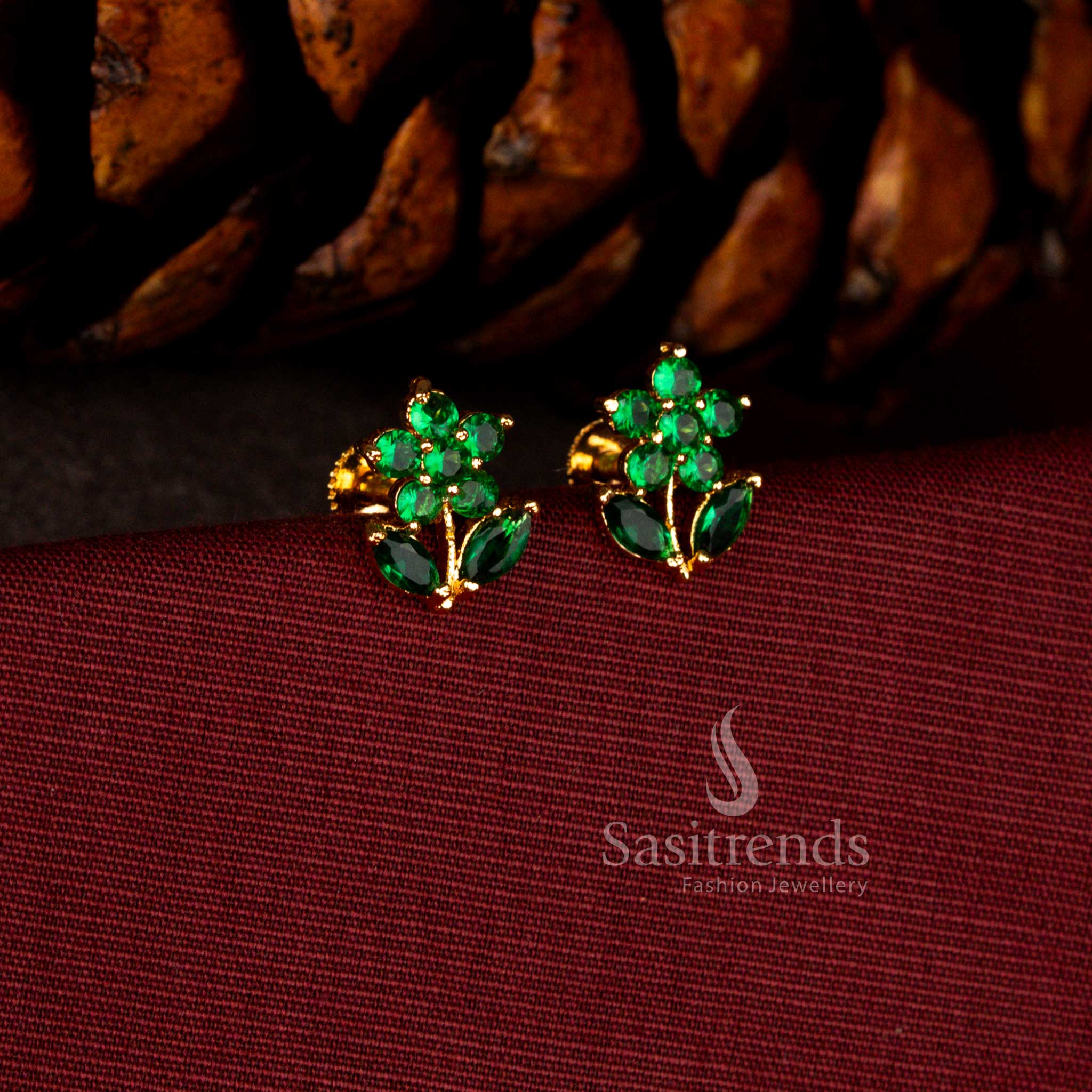 Sasitrends luxury micro gold plated green AD floral starburst earrings showcasing brilliant stones, sculpted marquise leaf detailing and a guaranteed real gold look finish ideal for grand occasions.