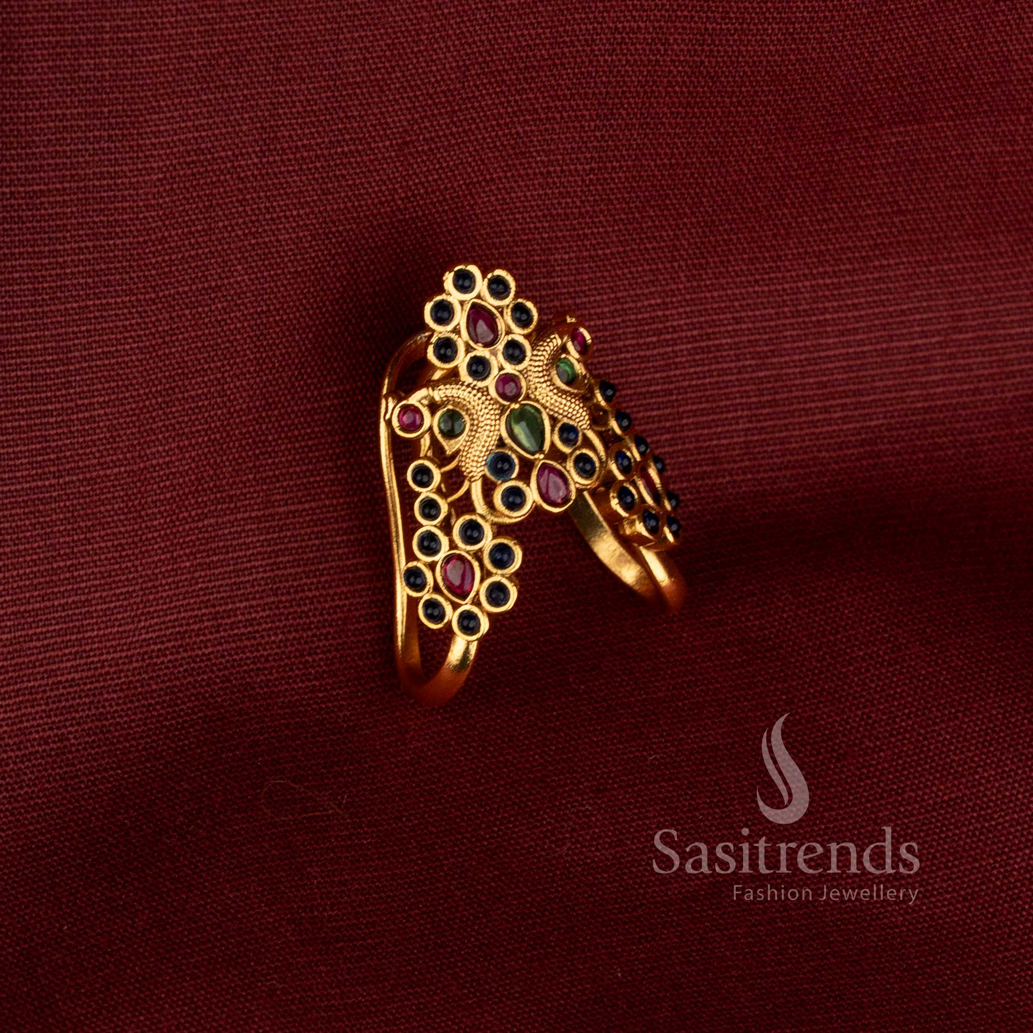 Traditional inspired Sasitrends fashion ring with sophisticated matte gold plating, an elaborate raised centre, multiple sparkling AD stones and ornate side construction designed for parties, festive occasions and special events