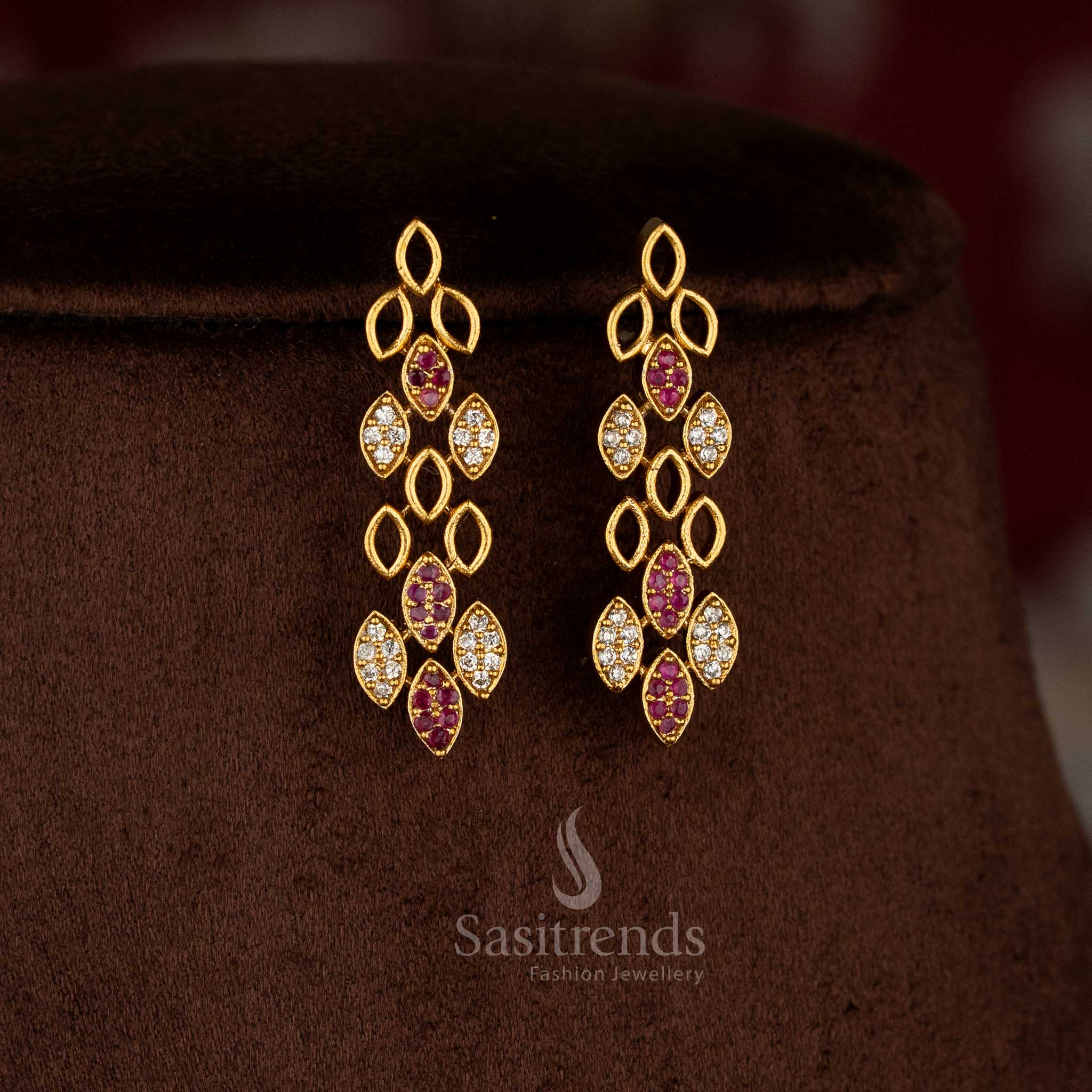 Sasitrends matte gold white ruby American Diamond necklace and earrings set offering a premium rich look for saree and wedding wear