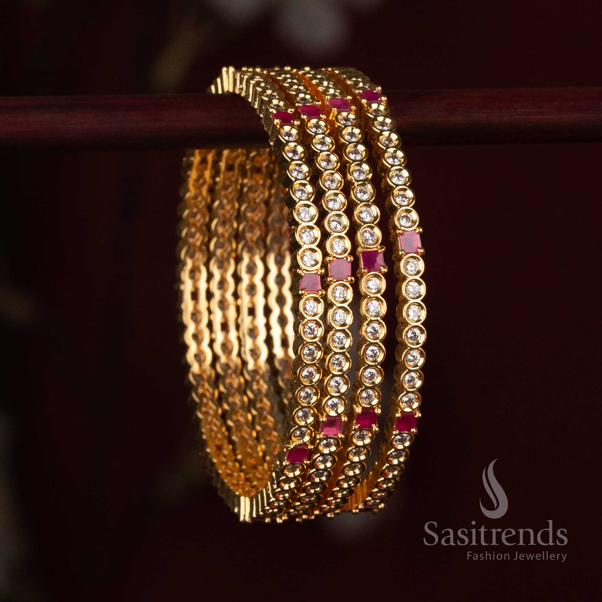 
Sasitrends Micro Gold Plated AD stone fashion bangle collection featuring continuous round stone setting and an elegant structured design
