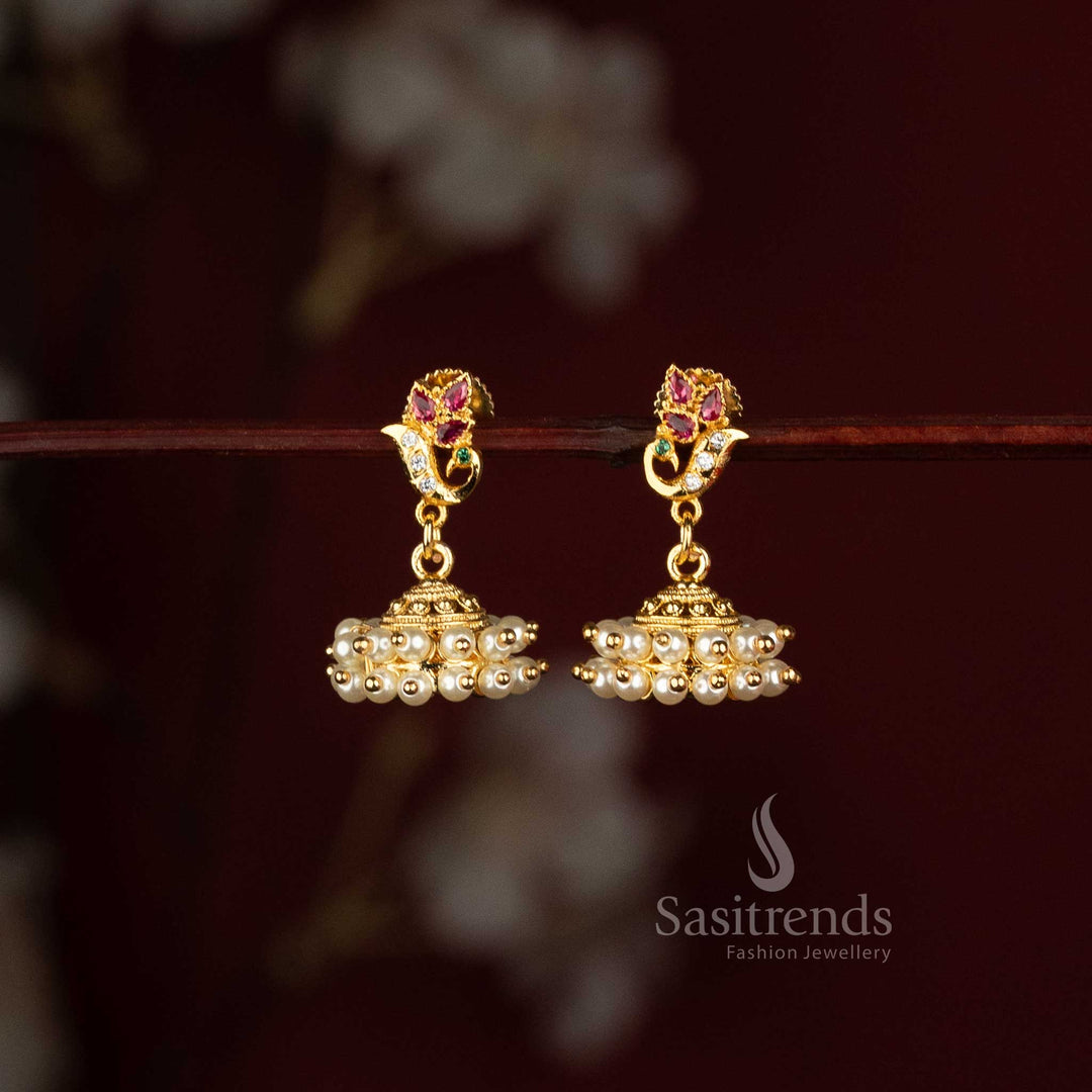Sasitrends Micro Gold Plated AD Stone floral jhumka earrings with ornate dome structure and layered pearl fringe for traditional occasions 