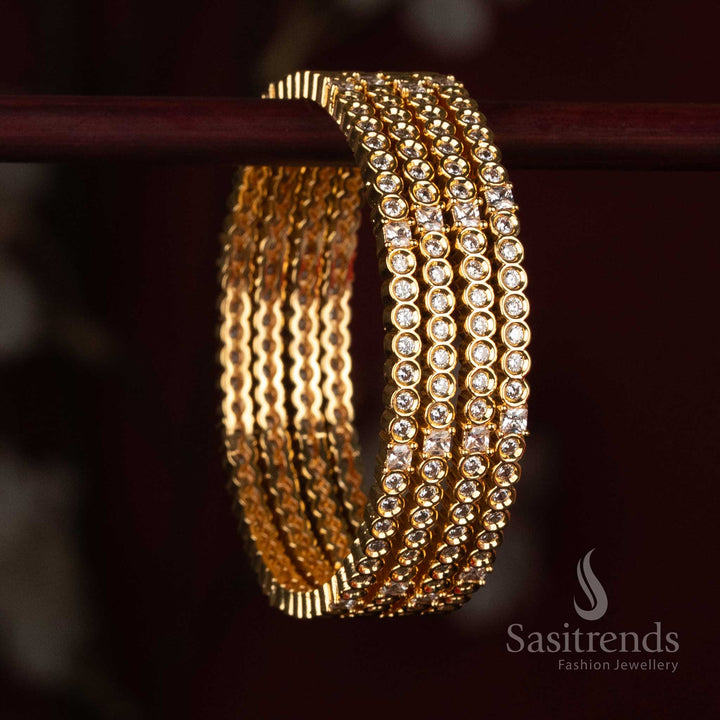 
Sasitrends Micro Gold Plated American Diamond stone studded designer bangle with multiple rows of round stone detailing and structured accents
