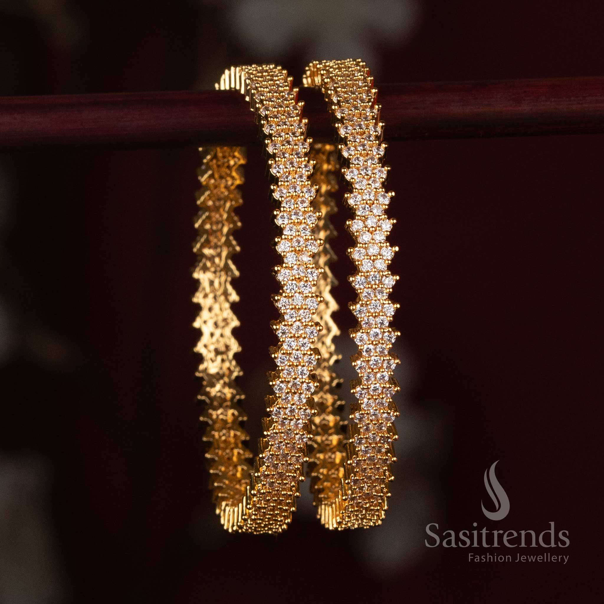 
Sasitrends Micro Gold Plated American Diamond stone studded floral cluster designer bangle with intricate repeating stone detailing across the wrist
