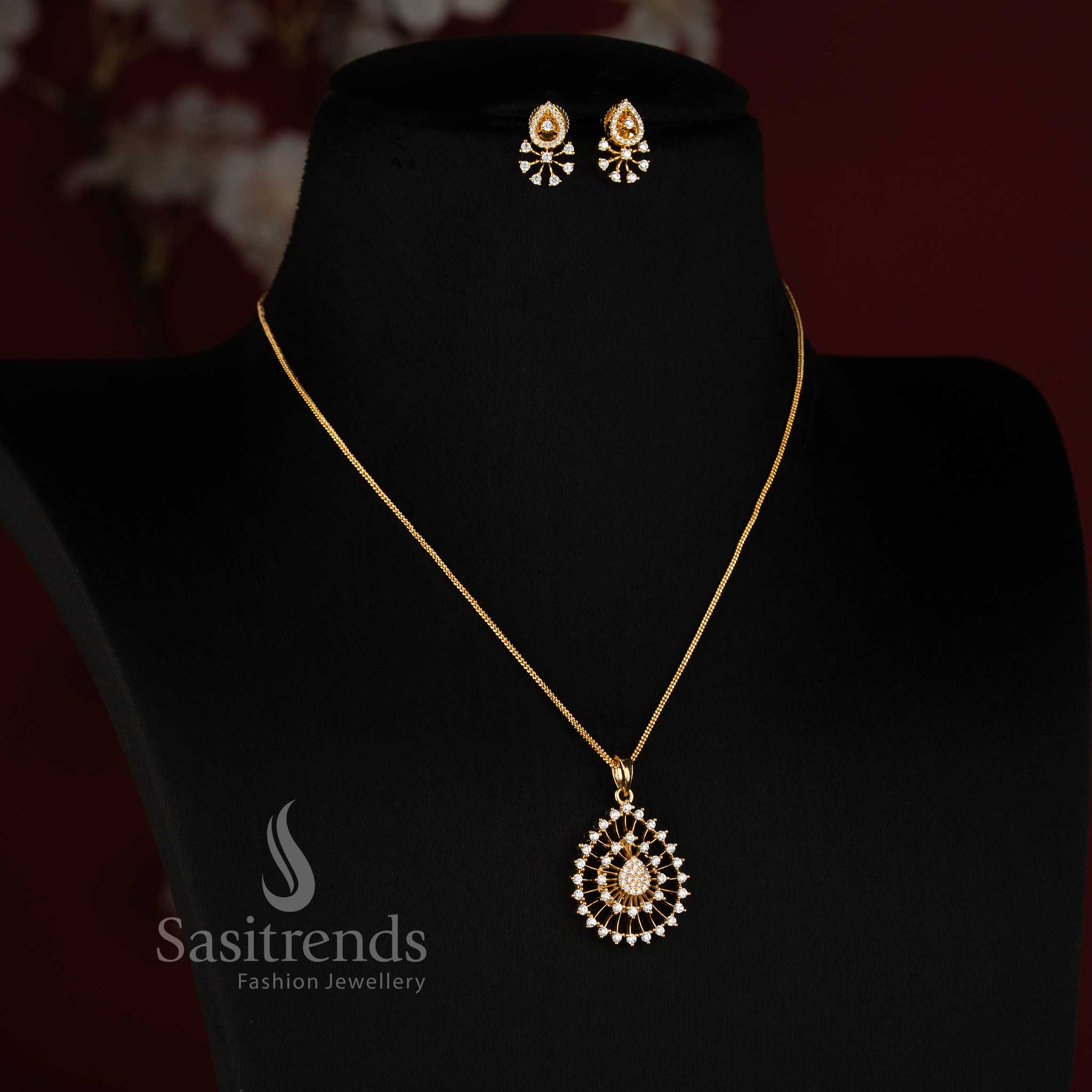 Sasitrends Micro Gold Plated American Diamond teardrop pendant chain necklace set with matching earrings and intricate openwork detailing for festive and party wear