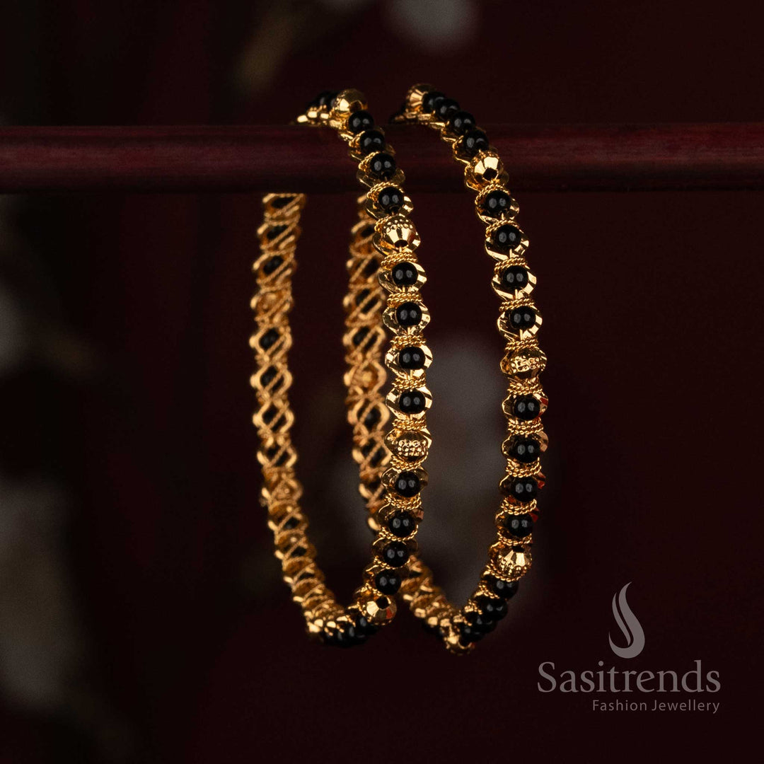 
Sasitrends Micro Gold Plated black bead designer bangle with ornamental gold spacer detailing arranged throughout the wrist design
