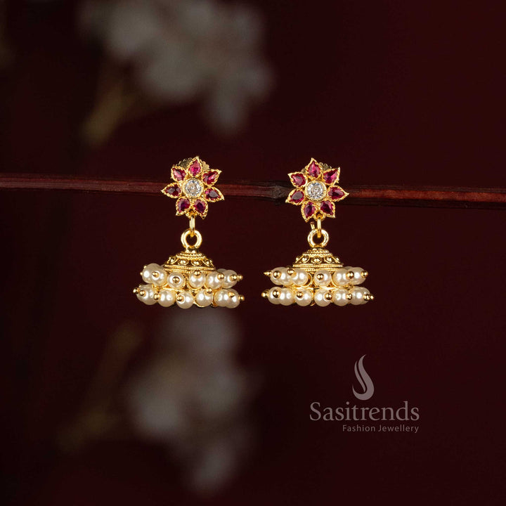 Sasitrends Micro Gold Plated floral American Diamond stone pearl jhumka earrings with dome-shaped traditional design for festive wear 